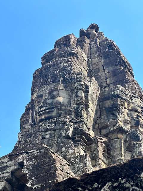 Close-up of a carved stone face on a temple.