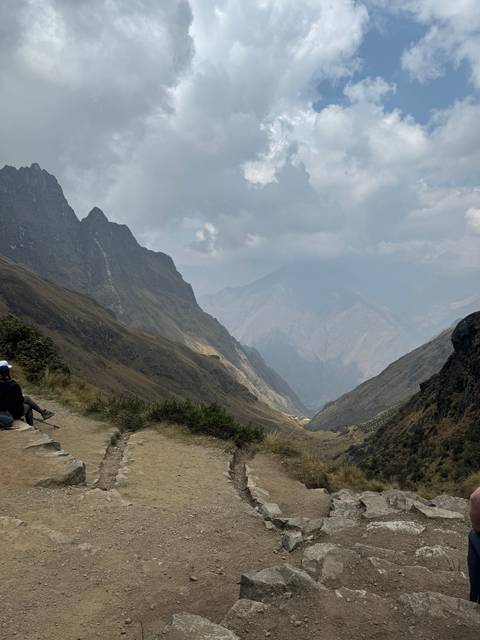 Mountain landscape with a clear sky and rocky terrain.