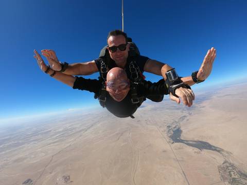       Tandem skydivers freefalling.
  