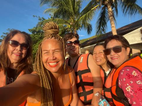       Group selfie of friends enjoying their time outdoors.
  