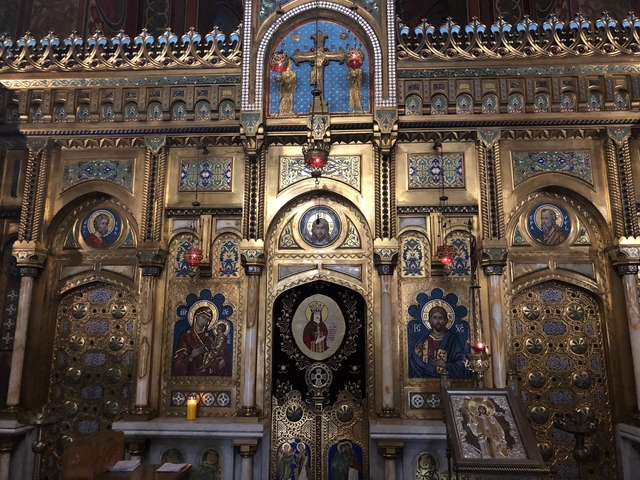 Ornate altar inside a church featuring religious iconography.