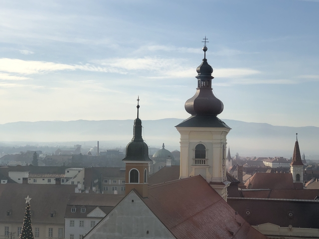 Panoramic view of a city with cathedral spires.