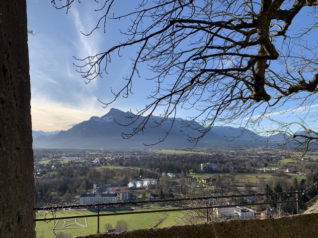 Mountain landscape with a view of a city from a higher vantage point.