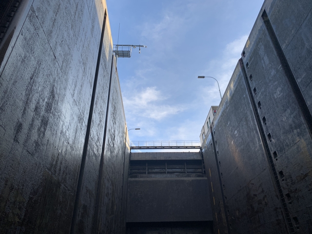 View of the sky from within a lock chamber.