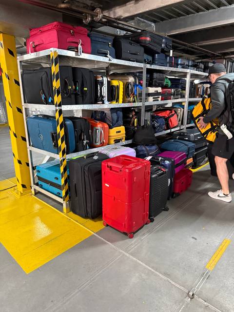 Luggage stacked inside a ferry.