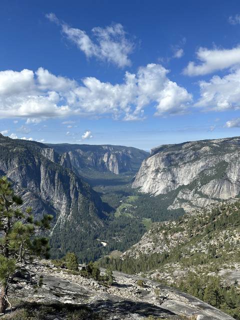       View across a mountain range under a clear sky.
  