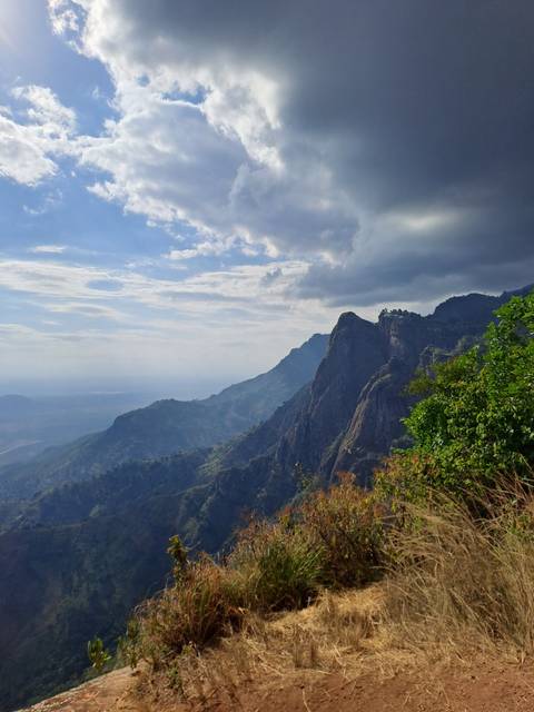 Mountainous landscape with dramatic sky.