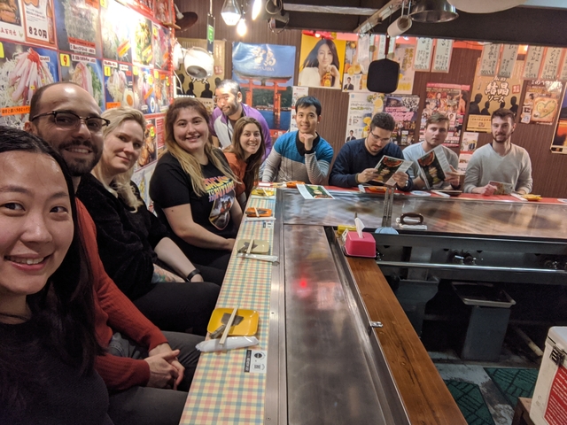 Group of people dining in a restaurant.