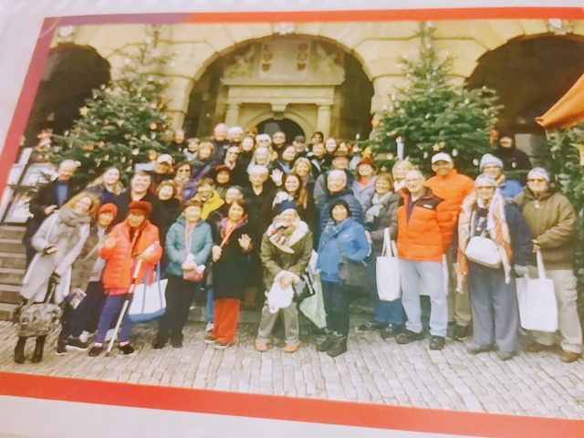 Group of people posing together outdoors