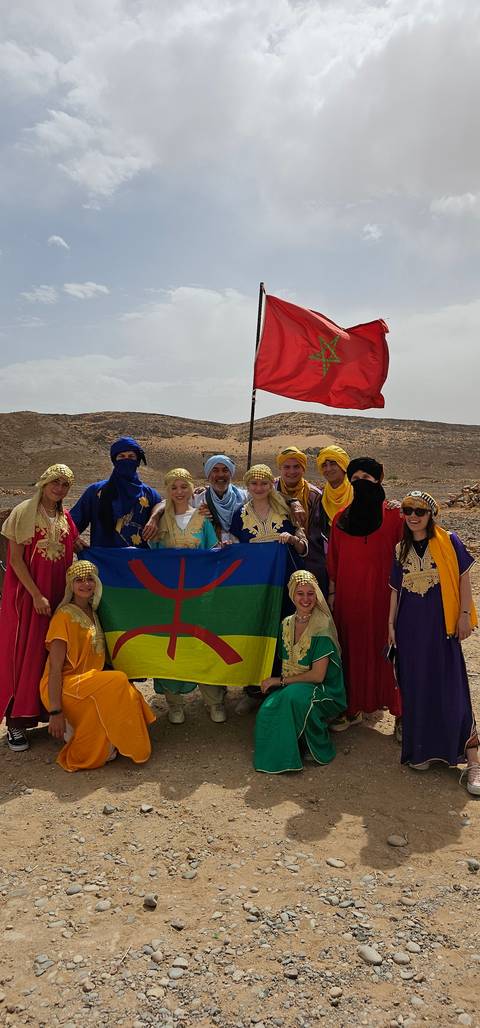       Group with flag colors and desert background.
  