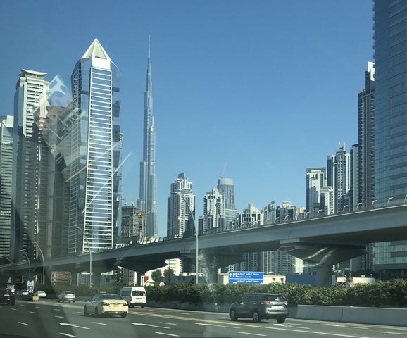       Skyline featuring tall modern skyscrapers and a prominent tower.
  