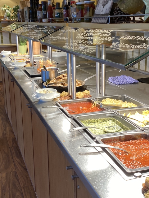 Buffet area with various dishes on display.