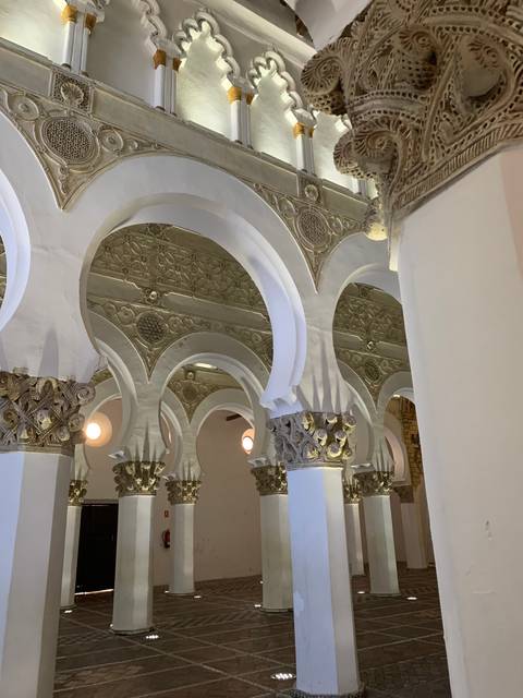 Interior architectural details with arches and columns.