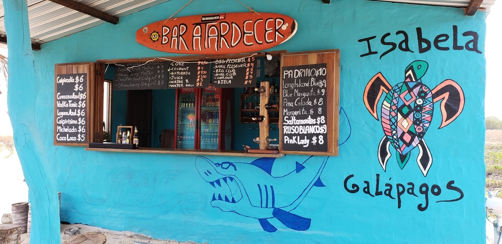       Colorful bar with painted wall decor in Isabela, Galapagos.
  