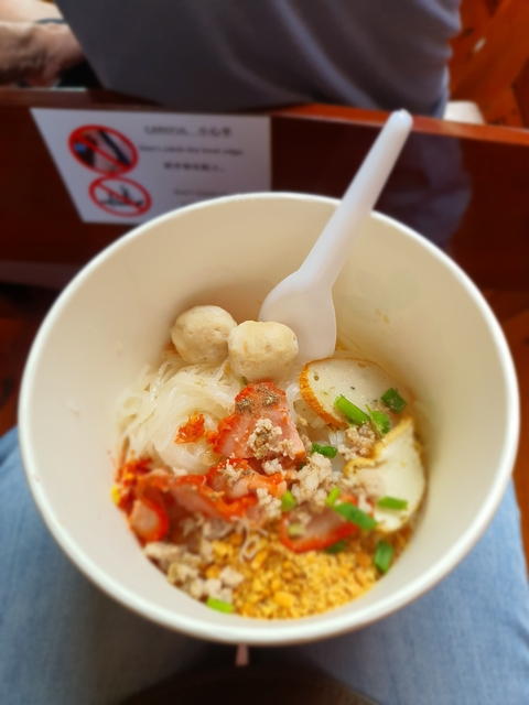 Bowl of noodles with meatballs and vegetables