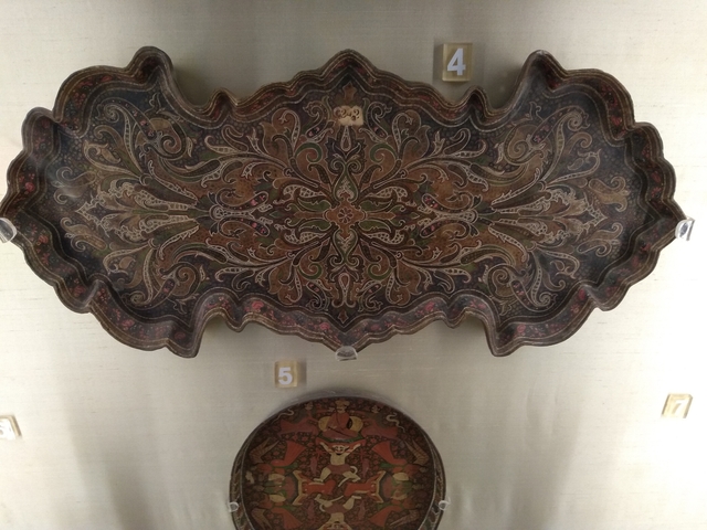Ornate decorated tray on display.
