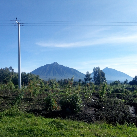       Landscape with two volcanic mountains under a clear sky.
  