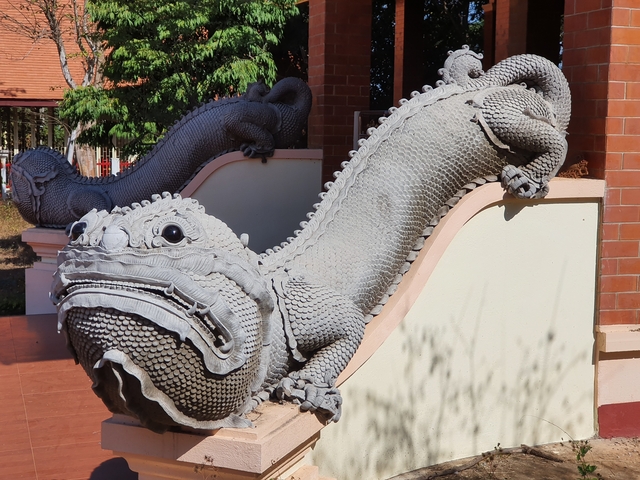 Sculptural depiction of mythical creatures on an architectural element.