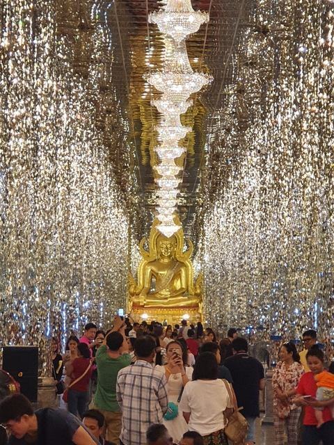 Buddha statue in a glittering shrine.
