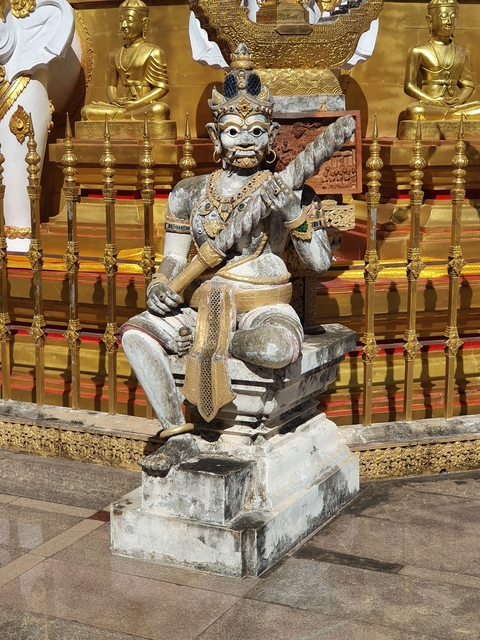 Statue with intricate gold detailing.