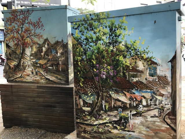       Artistic murals depicting a street scene.
  