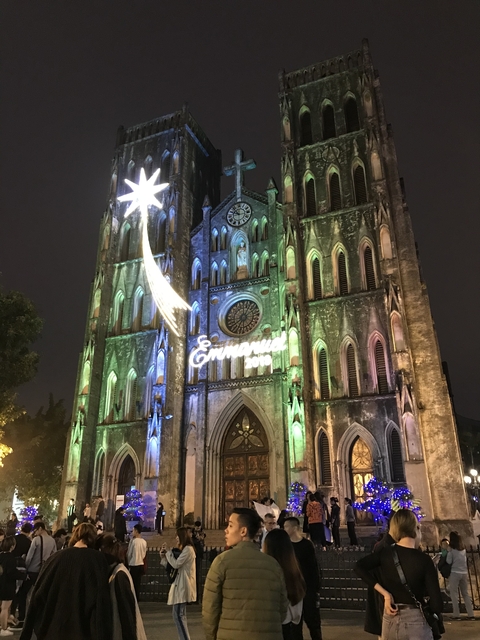      Illuminated cathedral decorated for Christmas at night.
  