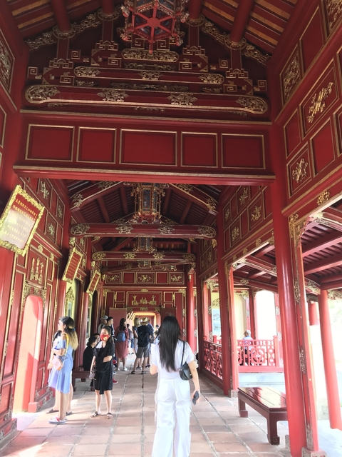       Traditional red and gold Vietnamese architectural details.
  