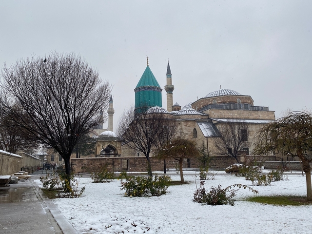       Rumi Museum with snow-covered garden.
  