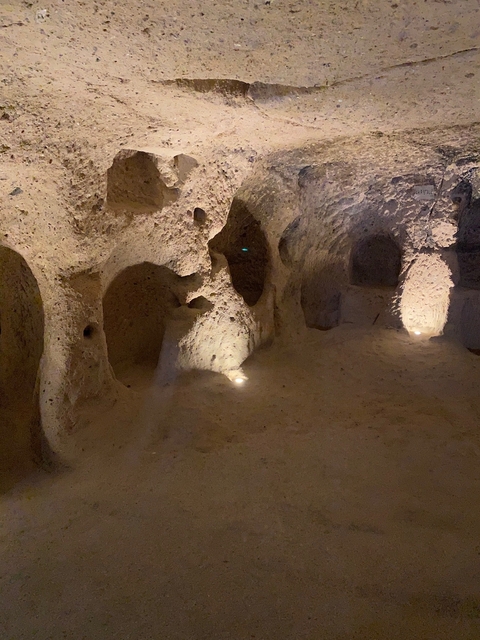       Underground cave with warm lighting.
  