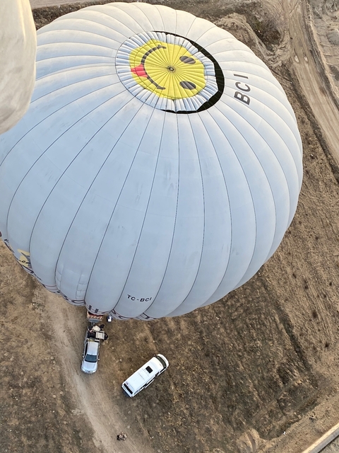       Close-up of a large hot air balloon from above.
  