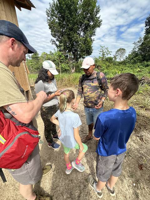 Group of people interacting in an outdoor environment.