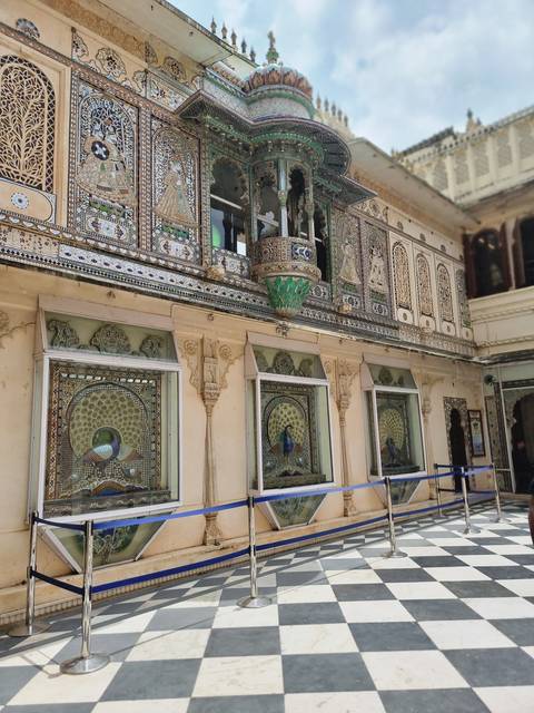       Decorated exterior wall with intricate designs.
  