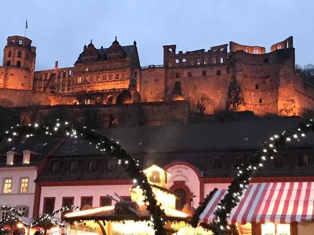 Illuminated castle at night.