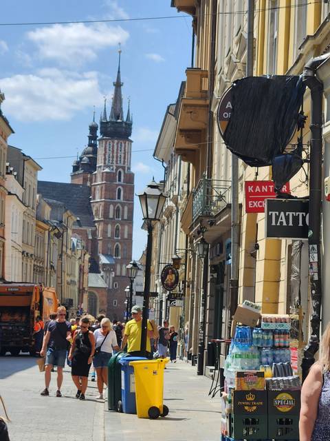       A vibrant street bustling with people and shops.
  
