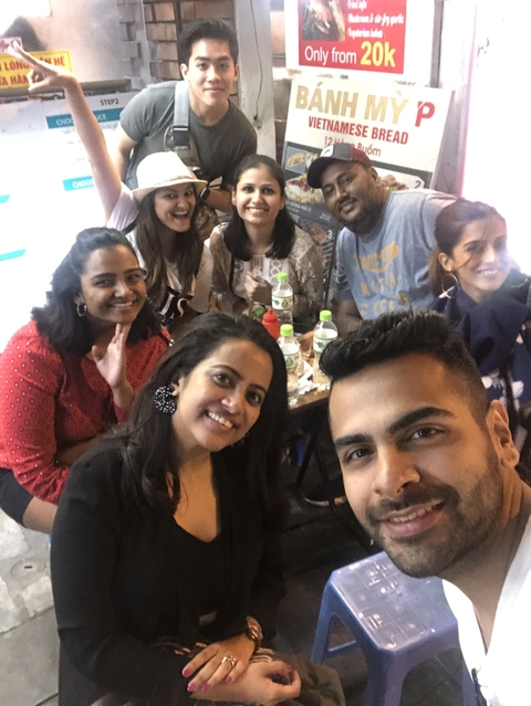 Group of friends at a table with drinks.