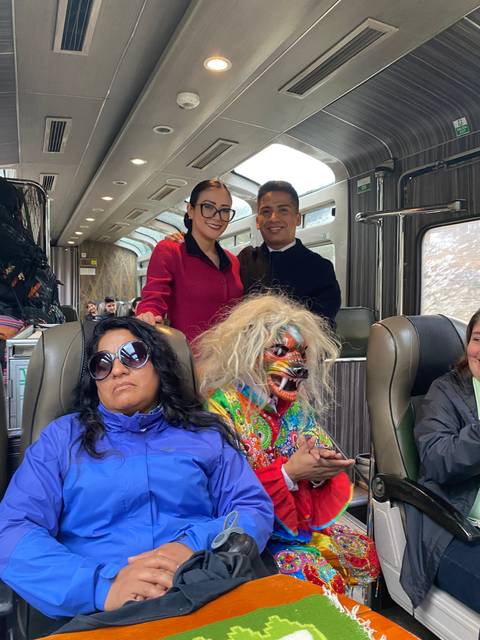 Group of people on a train with traditional costumes