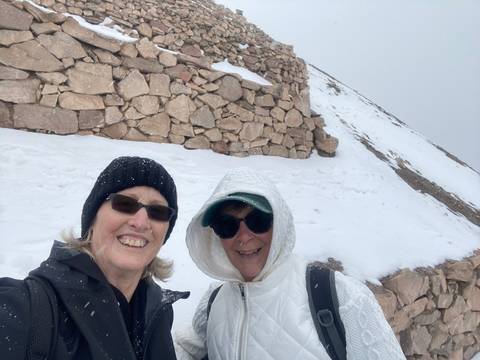       Upside-down photo of two people in snowy setting
  