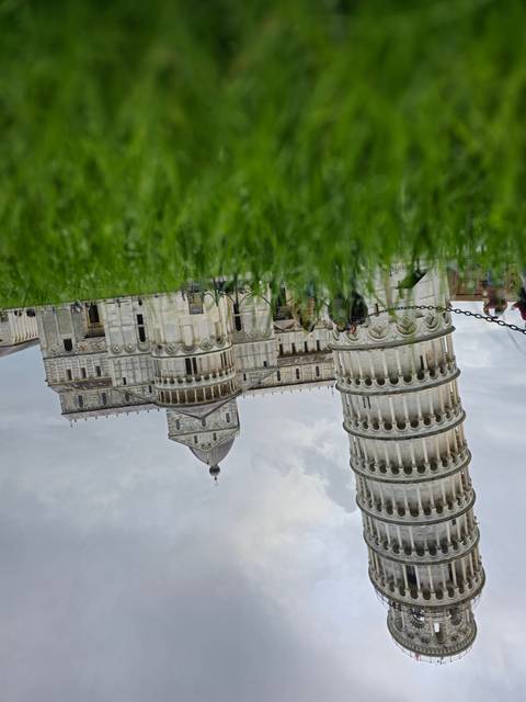 Leaning Tower of Pisa seen from ground level.