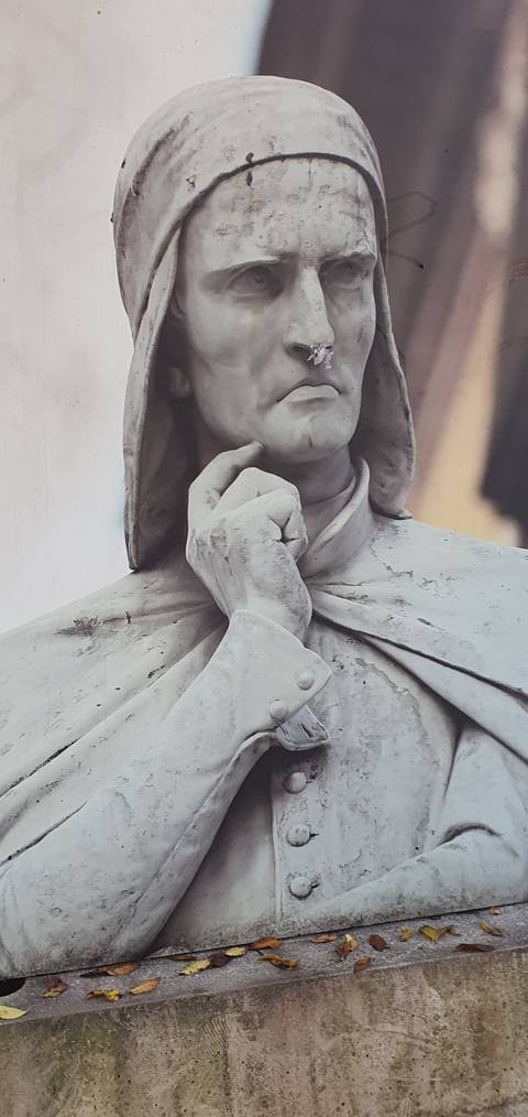 Close-up of a marble statue of a hooded figure
