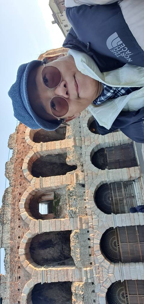 Tourist posing in front of a historic building