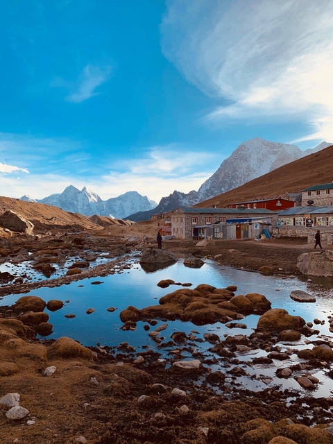 Mountain village with water stream.