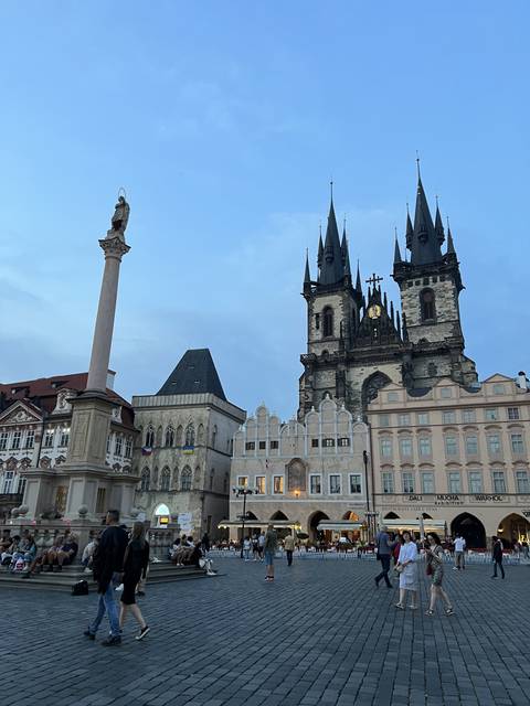       Large square with a historic building and clock.
  