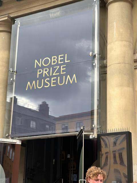       Nobel Prize Museum entrance with signage.
  