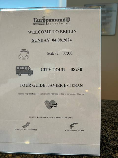 A printed sign for a Berlin city tour.