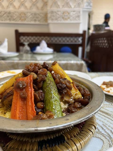 Traditional meal with vegetables and rice served on a dish.