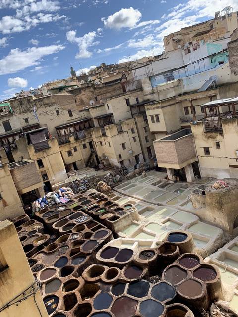 Complex of colorful dyeing vats in a traditional tannery.