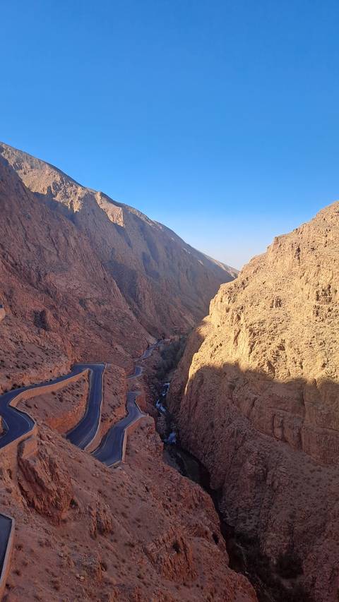 A winding road through a canyon landscape.