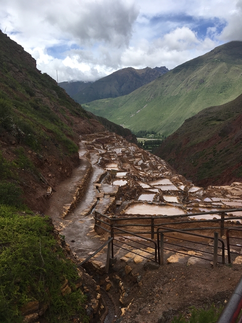       Terraced salt evaporation ponds in a mountainous region.
  