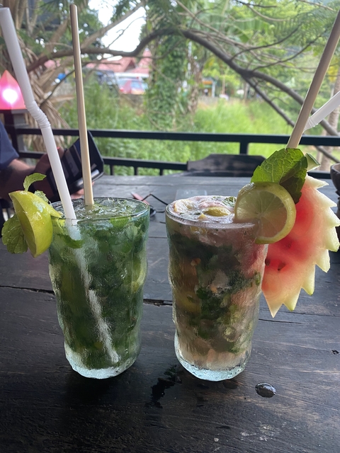       Close-up of two decorative drinks with lime and mint.
  