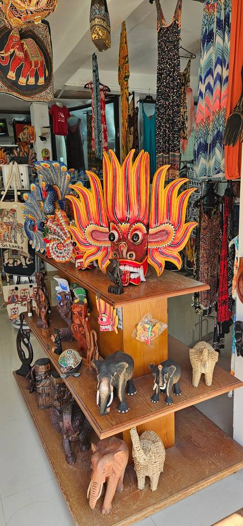 Vibrant masks and souvenirs displayed in a shop.